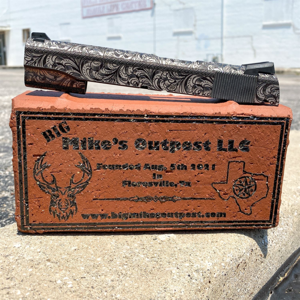 Scroll-engraved 1911 slide on a Big Mike's Outpost brick