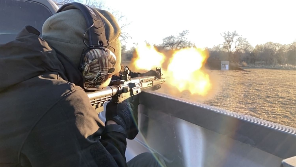 Muzzle flash at sunset on the range