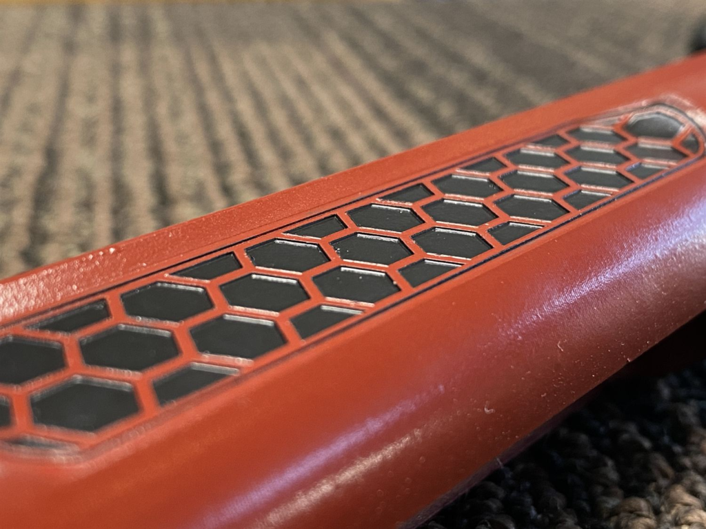 Orange and black hex-pattern finish